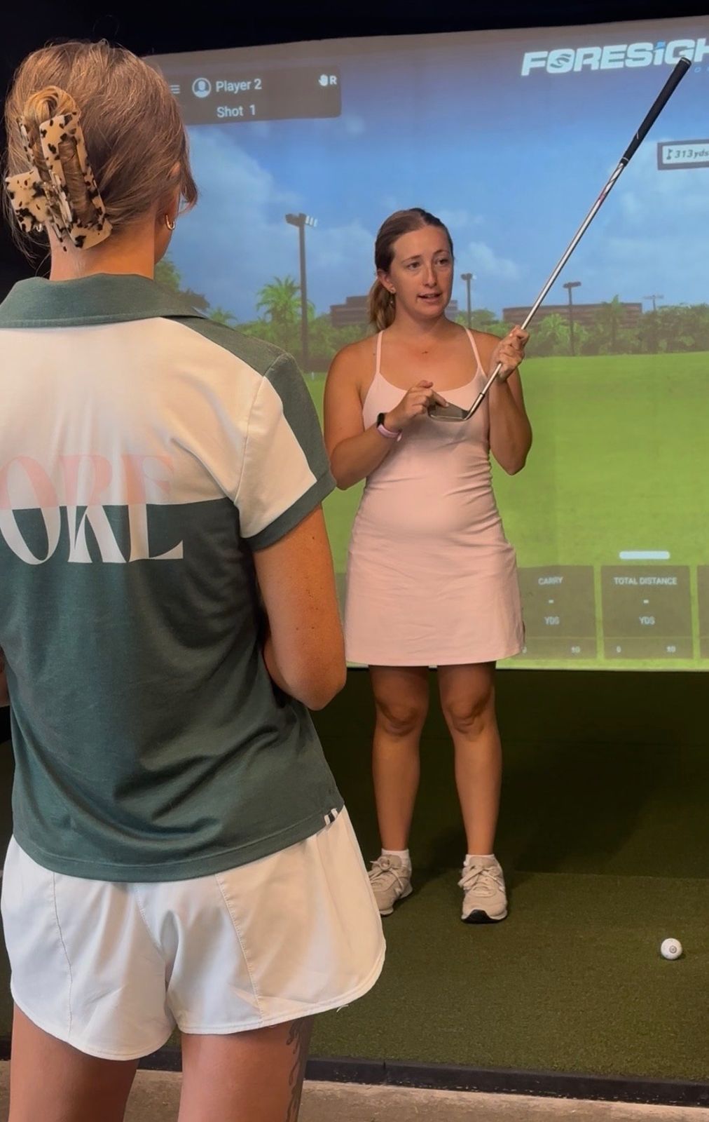 Deb teaching a woman in the simulator