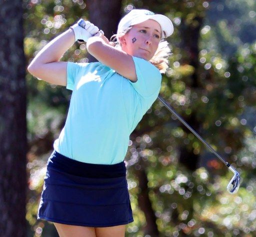 Deb Spair hitting an iron shot